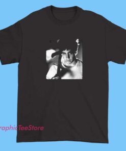 A graphic T-shirt featuring artwork inspired by Donnie Darko, showcasing imagery such as a creepy rabbit mask, a distorted clock, or surreal scenes from the film, designed for fans of the cult classic movie.
