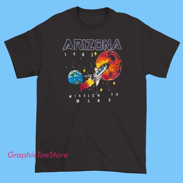 Arizona 1982 Mission To Mars shirt 2 Vintage-style T-shirt featuring a graphic design of Arizona with a retro '1982 Mission to Mars' theme, including space-themed illustrations like rockets, planets, and stars, combined with bold, distressed text to evoke a nostalgic, sci-fi-inspired look.