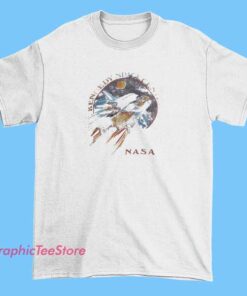 A graphic tee shirt featuring the Kennedy Space Center logo and space-themed imagery, perfect for space enthusiasts and fans of NASA.