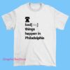 Gray T-shirt with the phrase 'Badass Things Happen in Philadelphia' printed in bold, urban-style font, celebrating Philadelphia's vibrant and rebellious spirit.