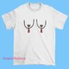 A festive Christmas-themed T-shirt featuring playful and humorous graphics, including nipple tassels incorporated into holiday designs such as Santa hats, Christmas trees, or ornaments. The style is fun, cheeky, and suitable for holiday parties or celebrations