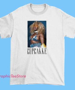 A T-shirt featuring a bold, vibrant graphic of rapper Cupcakke, showcasing her confident pose and energetic style, designed to resemble a photo poster with striking colors and dynamic lettering, perfect for fans of her music and personality.