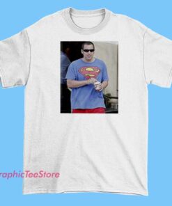 A fun graphic T-shirt featuring Zach Schwartz and Adam Sandler with a Superman theme, possibly depicting caricatures or humorous designs related to Superman, showcasing a playful and pop culture-inspired style.