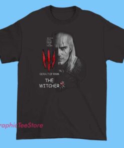 A white T-shirt featuring a graphic of Geralt of Rivia from The Witcher series, showcasing his signature silver hair, scarred face, and iconic wolf medallion, capturing the character’s rugged and heroic look.
