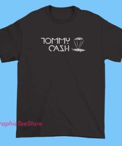 A vintage-style Tommy Cash merchandise T-shirt featuring bold, retro-inspired graphic designs with edgy text and imagery, reflecting the artist's unique and rebellious aesthetic.