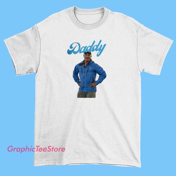 Hurricane Florida Daddy Jim Cantore Shirt 2 A man wearing a shirt with a Hurricane Florida Jim Cantore theme, possibly featuring images or text related to Jim Cantore and hurricane coverage.