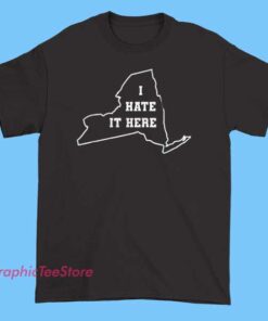 Funny State Joke It Here I Hate New York Shirt 3 Humorous T-shirt featuring the phrase 'It’s Here, I Hate New York' with a playful map outline of New York State, possibly including a funny graphic like a grumpy cartoon New Yorker or a witty slogan to make light of the state.