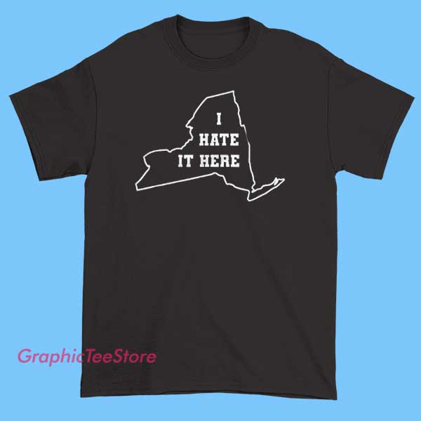 Funny State Joke It Here I Hate New York Shirt 2 Humorous T-shirt featuring the phrase 'It’s Here, I Hate New York' with a playful map outline of New York State, possibly including a funny graphic like a grumpy cartoon New Yorker or a witty slogan to make light of the state.