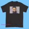 Funny Fredo Santana mugshot shirt featuring expressive facial expression graphic, hip hop inspired tee, rapper merch style, streetwear fashion, and vintage rap culture design