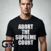 Abort the Supreme Court Text Activism Shirt featuring a bold political statement graphic, social justice message, reproductive rights theme, and cotton short sleeve design.