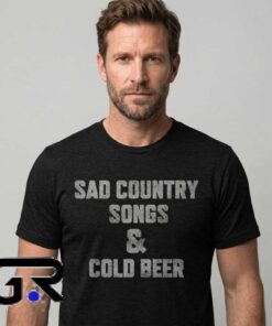 Sad Country Songs & Cold Beer slogan black T-shirt with country music graphic design, humorous beer saying, Southern style, and casual Western-inspired fashion.
